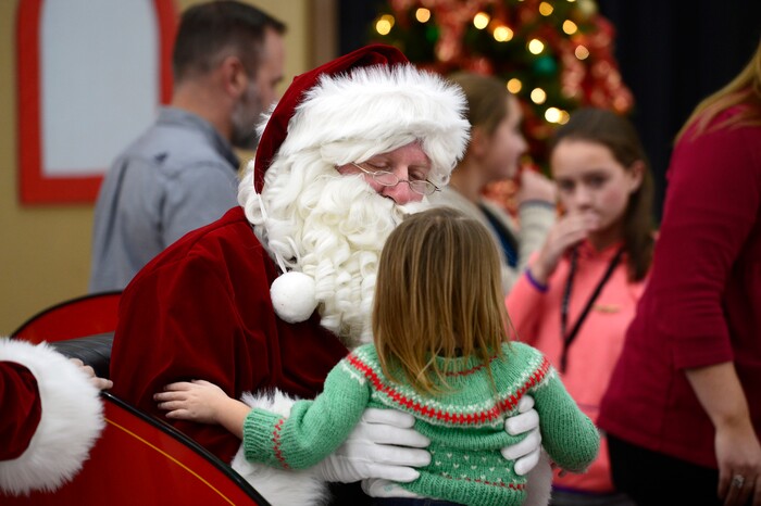 (Scott Sommerdorf   |  The Salt Lake Tribune)   Santa speaks with children as patients from Primary ChildrenÕs and Shriners Hospitals were treated to a unique experience on Saturday at a Delta hangar of the Slat Lake International airport. They boarded a Boeing 737 which taxied to their final destinationÑSantaÕs Winter Wonderland, Saturday, December 2, 2017.  