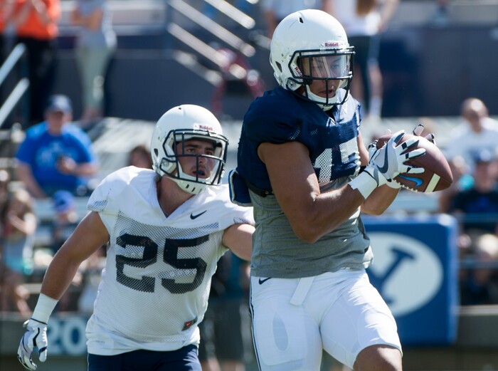 (Rick Egan  |  The Salt Lake Tribune) BYU tightens Moroni Laulu-Pututau catches a pass, as defensive back Tanner Jacobson defends, during the BYU Cougars public scrimmage at Lavell Edwards Stadium, Thursday, August 17, 2017.