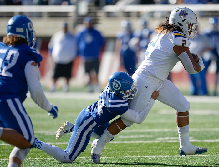 (Francisco Kjolseth  |  The Salt Lake Tribune)  Orem's Noah Sewell pushes past Dixie in the 4A high school championship game at Rice Eccles Stadium in Salt Lake City, Friday, Nov. 16, 2018.