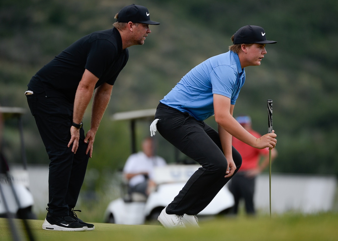 (Francisco Kjolseth  |  The Salt Lake Tribune)  Preston Summerhays, 16, is joined on the green with his father and caddy Boyd on his way to repeating as State Amateur golf champion at Soldier Hollow Golf Course on Saturday, July 13, 2019, beating Chase Lansford 7 and 6 in the final championship match.
