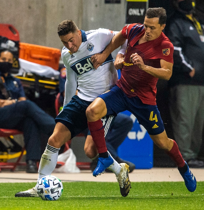 (Rick Egan  |  The Salt Lake Tribune)   Real Salt Lake defender Donny Toia (4) brings the ball down field as Vancouver Whitecaps defender Jake Nerwinski (28) defends, in MLS soccer action between Real Salt Lake and the Vancouver Whitecaps at Rio Tinto Stadium on Saturday, Sept. 19, 2020.

 