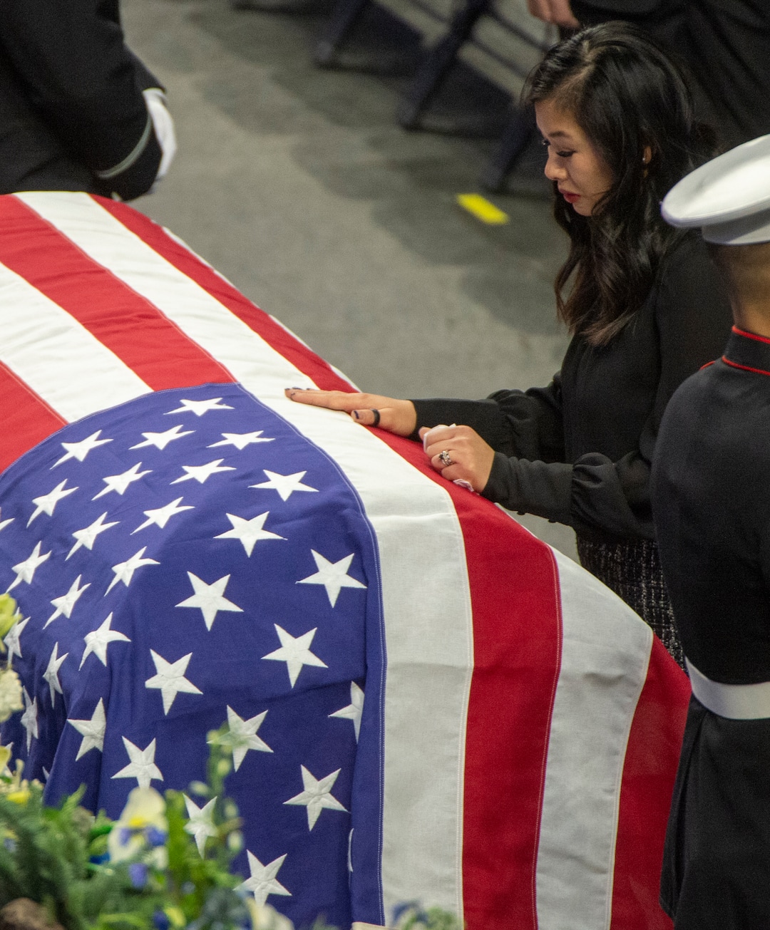(Rick Egan  |  The Salt Lake Tribune)     Elizabeth Romrell spends a moment  by the casket of her husband, South Salt Lake police officer, David Romrell, before his funeral at the Maverik Center, in West Valley City, Wednesday, Dec. 5, 2018.