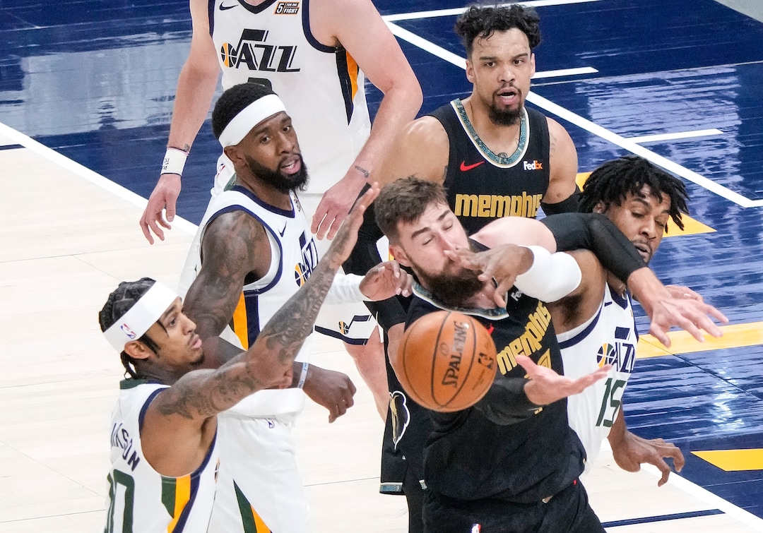(Leah Hogsten | The Salt Lake Tribune) Utah Jazz center Derrick Favors (15) and Utah Jazz guard Jordan Clarkson (00) battle Memphis Grizzlies center Jonas Valanciunas (17) for the rebound as the Utah Jazz take on the Memphis Grizzlies during Game 1 of the first-round playoffs at Vivint Arena, May 23, 2021.
