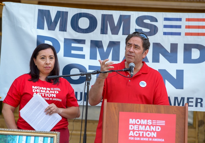 (Leah Hogsten  |  The Salt Lake Tribune) “We can make progress here in Utah. Let’s keep going. We have no alternative if we want to save lives,” said Representative Brian King at the podium with Representative Angela Romero, who also spoke. Members of Moms Demand Action for Gun Sense in America gathered at Washington Square Park to demand change in gun laws in reaction to the August mass shootings in Dayton, Ohio and El Paso, Texas, and the hundreds of Americans who are wounded and killed by gun violence every day.