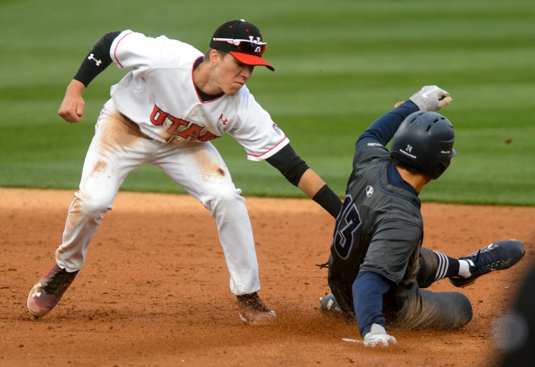 (Steve Griffin  |  The Salt Lake Tribune)  Utah shortstop Matt Richardson tags out BYU baserunner Brian Hsu during the BYU versus Utah baseball game at Smiths Ballpark in Salt Lake City Tuesday April 3, 2018.