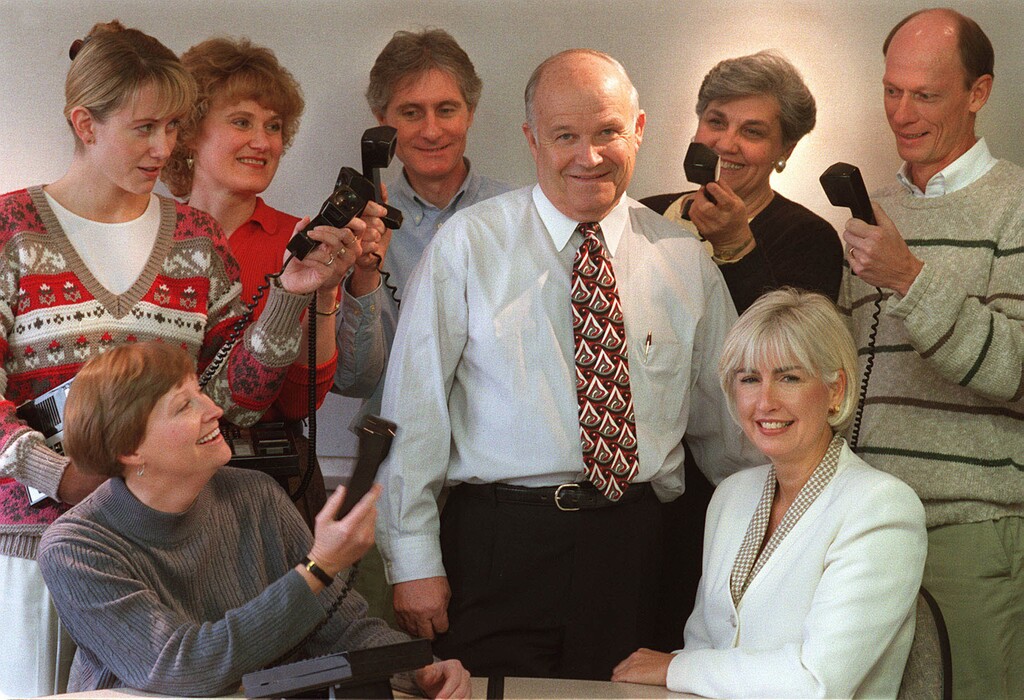(Leah Hogsten  |  Tribune file photo) Pollster Dan Jones with wife, Pat, and his staff at his offices at Trolley Corners on Nov. 19, 1998. 