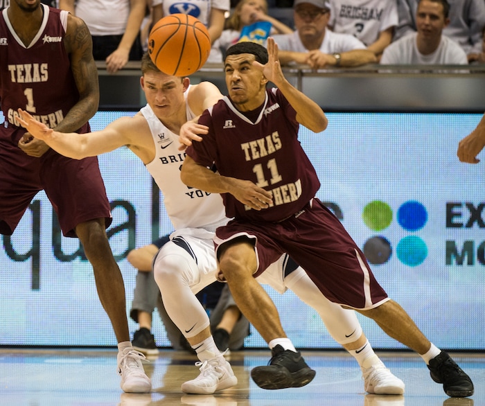 (Rick Egan  |  The Salt Lake Tribune)   Brigham Young Cougars guard McKay Cannon (24) tries to snag the ball from Texas Southern Tigers guard Brian Carey (11), in basketball action, Brigham Young Cougars vs Texas Southern Tigers, at the Marriott Center in Provo, Saturday, December 23, 2017.