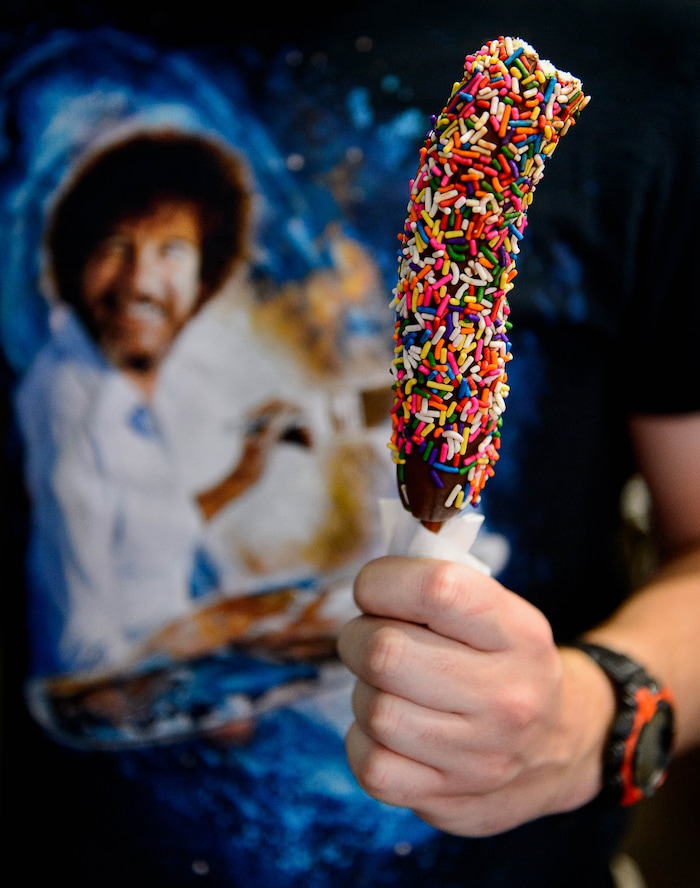 (Trent Nelson | The Salt Lake Tribune) A candied banana and a Bob Ross t-shirt make an appearance at the Utah State Fair in Salt Lake City, Thursday September 7, 2017.
