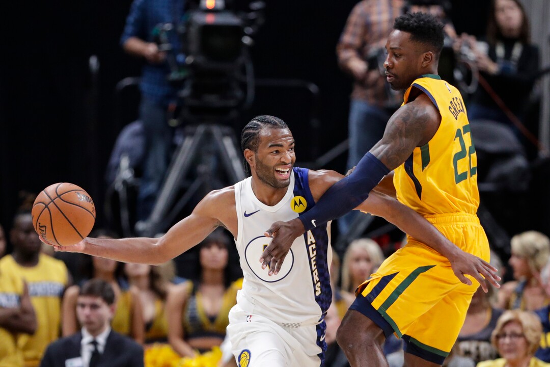 Indiana Pacers forward T.J. Warren (1) holds off Utah Jazz forward Jeff Green (22) during the second half of an NBA basketball game in Indianapolis, Wednesday, Nov. 27, 2019. The Pacers won 121-102. (AP Photo/Michael Conroy)