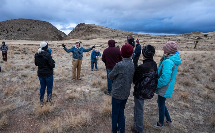(Leah Hogsten | The Salt Lake Tribune) "We know that for 5,000 years, people have been passing through the Gap," said Nancy Dalton, a guide with the Parawon Heritage Foundation giving an interpretive talk for about 20 people Saturday, Mar. 20, 2021 at the Parowan Gap during the spring equinox observance. "It's fascinating, the information that's here." Dalton, center, took the group to the location of cairns where Dalton said was the perfect spot to view the setting sun as it rolled into the vee of the Gap.