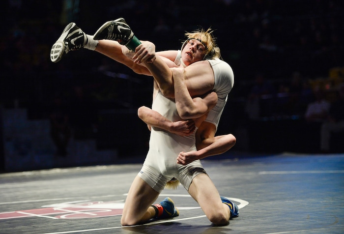 (Francisco Kjolseth  |  The Salt Lake Tribune) Oakley Ridge of Pleasant Grove is lifted by Kegan Leatherow of Fremont in the Class 6A 120 state wrestling championship match at the Utah Valley University UCCU Center on Thursday, Feb. 8, 2018.