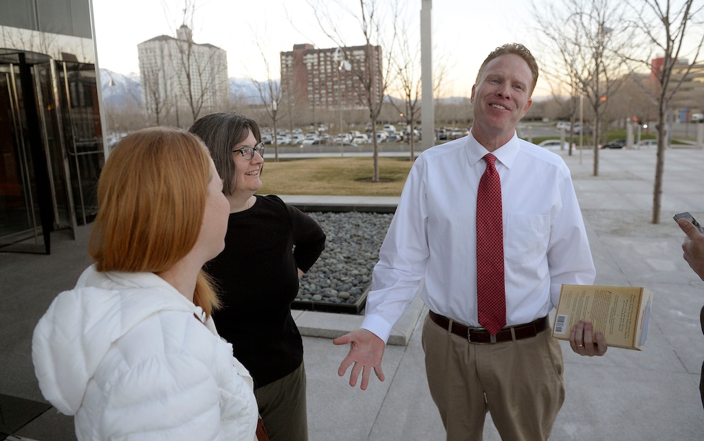 Al Hartmann  |  Tribune file photo
Jeremy Johnson walks to Federal Court in  Salt Lake City in this 2017 file photo, accompanied by his wife, Sharla, and lawyer Mary Coporon.
