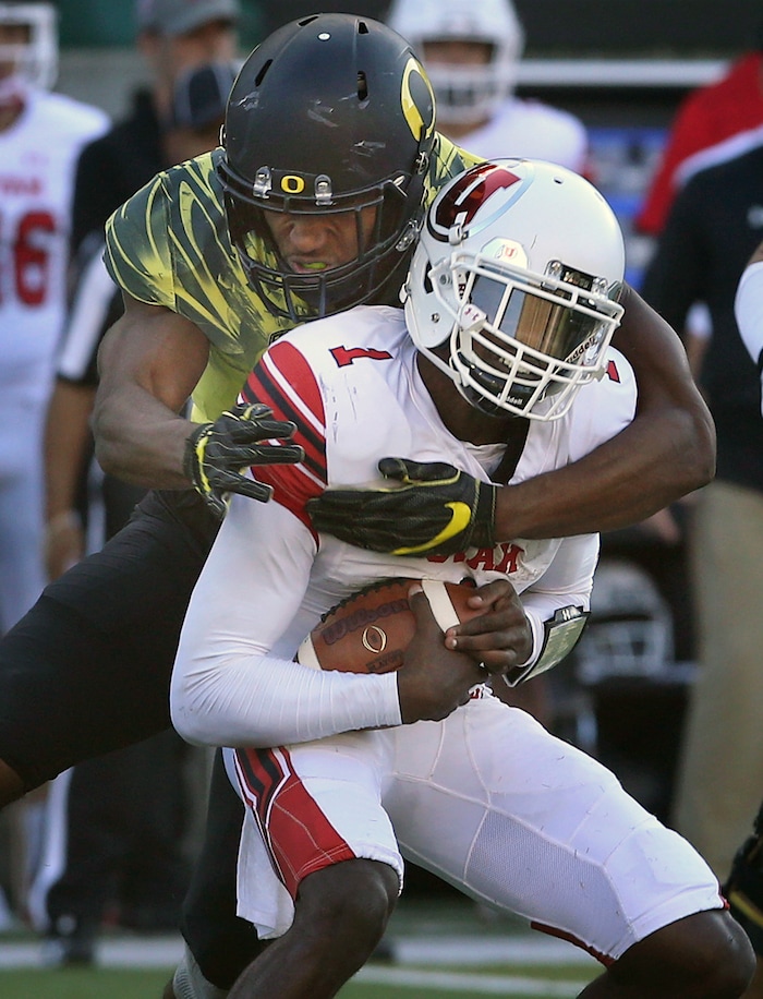 Utah quarterback Tyler Huntley is sacked by Oregon linebacker Justin Hollins during the second quarter of an NCAA college football game Saturday, Oct. 28, 2017, in Eugene, Ore. (AP Photo/Chris Pietsch)