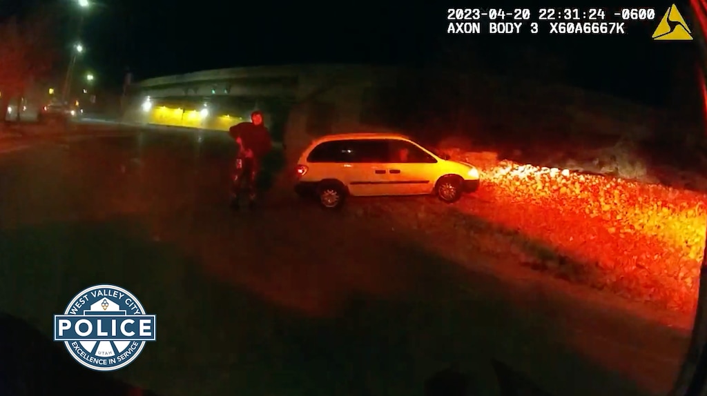 (Screenshot via West Valley City Police body camera footage) A man appears to reach into his waistband as a West Valley Police officer approaches him on April 20, 2023, ahead of a police shooting.