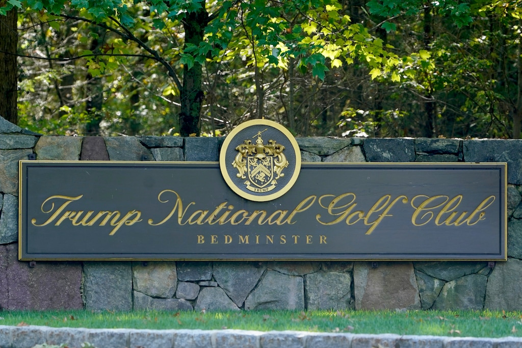 (Seth Wenig | AP file photo)  A sign is seen at the entrance to Trump National Golf Club in Bedminster, N.J., Friday, Oct. 2, 2020.