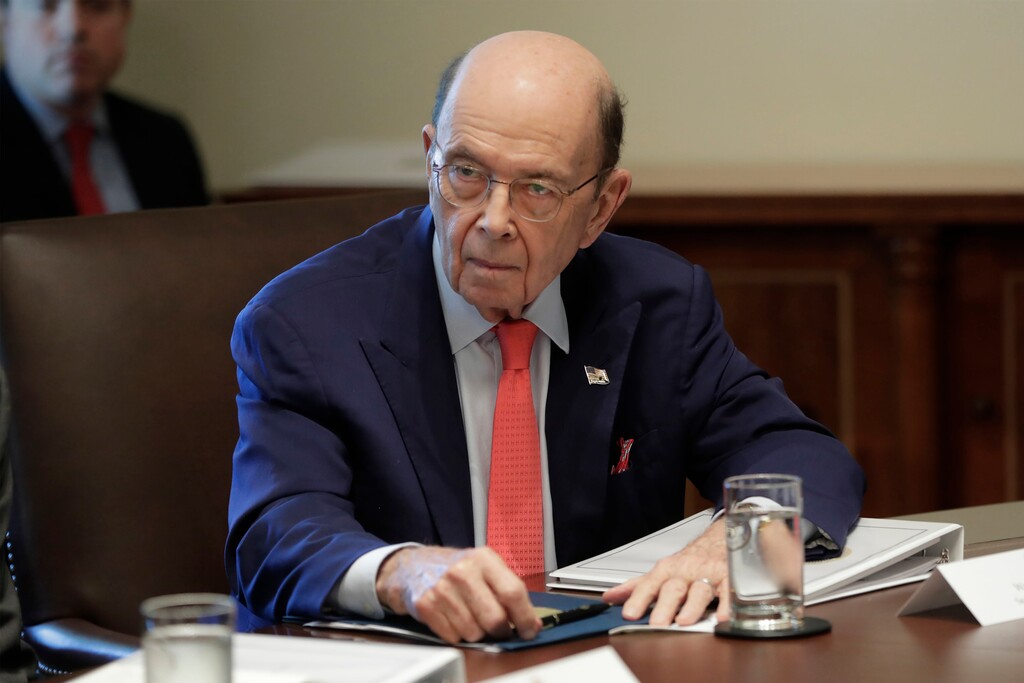 (Pablo Martinez Monsivais | AP file photo) In this Oct. 21, 2019 photo, Commerce Secretary Wilbur Ross listening to President Donald Trump speak during a Cabinet meeting in the Cabinet Room of the White House in Washington. Ross suggested Thursday, Jan. 30, 2020, that a viral outbreak in China could offer an upside to the U.S. economy by encouraging manufacturers to move back to America.