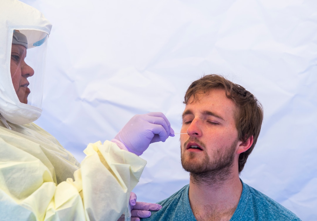 (Rick Egan  |  The Salt Lake Tribune)   Intermountain Healthcare medical assistant, Latoya Dovila, tests Preston Jenson, at the  Intermountain Healthcare Coronavirus Mobile Testing Unit at Utah Valley Hospital in Provo, Friday May 8, 2020.