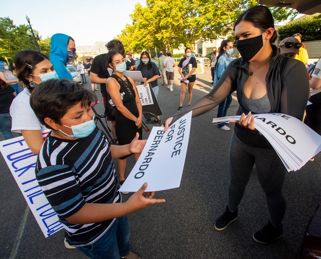(Rick Egan  |  The Salt Lake Tribune)      Protesters grab signs to put up in their neighborhoods, during a Justice for Bernardo demonstration, in Salt Lake City, Tuesday, July 7, 2020.