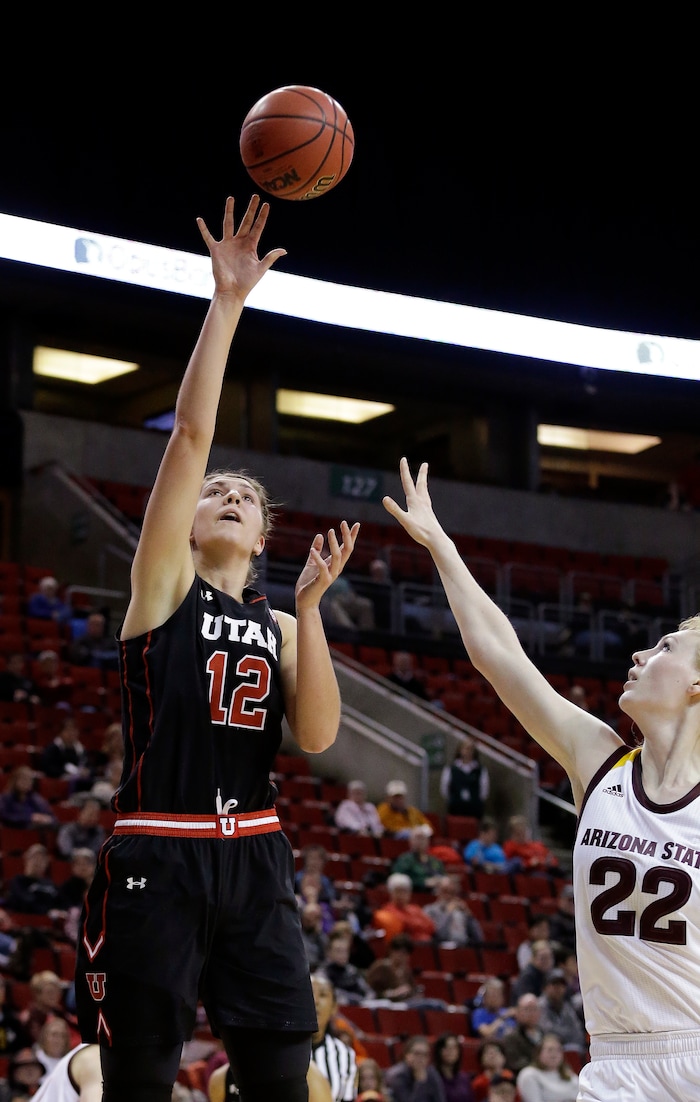 Utah's Emily Potter (12) shoots as Arizona State's Quinn Dornstauder defends in the first half of an NCAA college basketball game in the Pac-12 Conference tournament, Thursday, March 2, 2017, in Seattle. (AP Photo/Elaine Thompson)