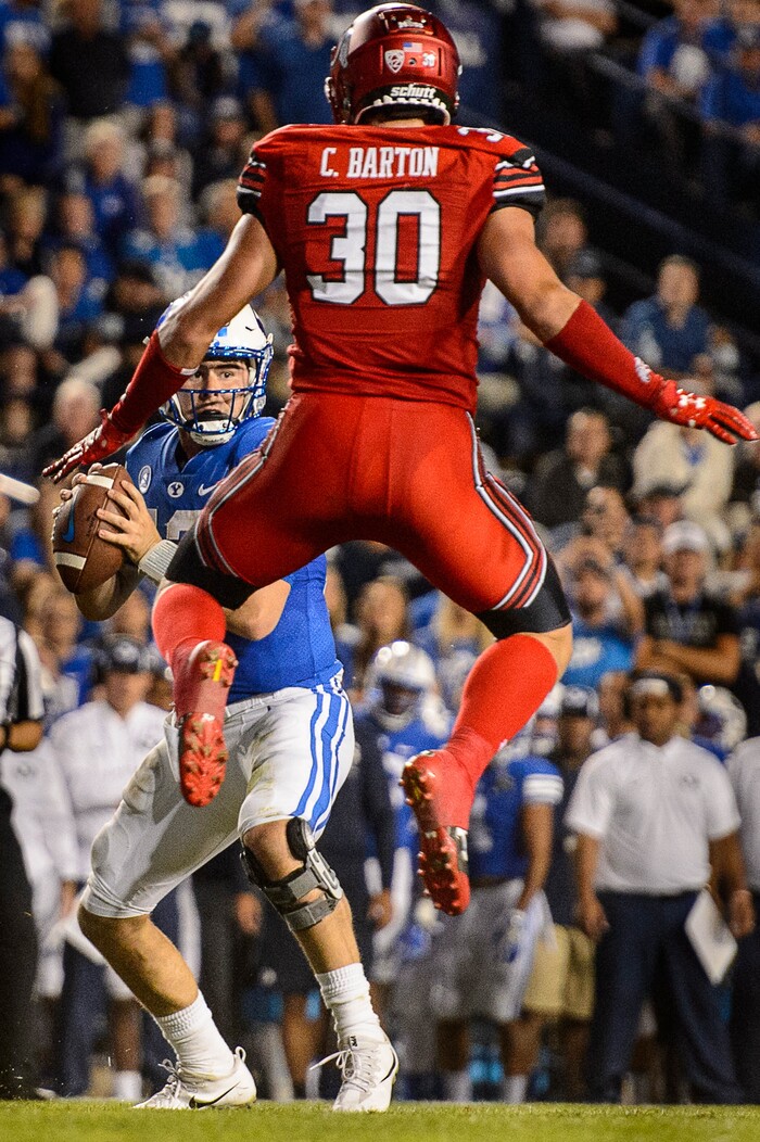 (Trent Nelson | The Salt Lake Tribune)  Utah Utes linebacker Cody Barton (30) leaps in front of Brigham Young Cougars quarterback Tanner Mangum (12) as BYU hosts Utah, NCAA football in Provo, Saturday September 9, 2017.