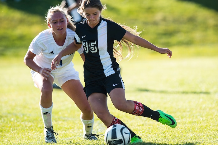 (Chris Detrick | The Salt Lake Tribune) Syracuse's Caroline Stringfellow (35) kicks past Fremont's Sarah Seaich (4) during the game at Fremont High School Thursday, October 5, 2017.