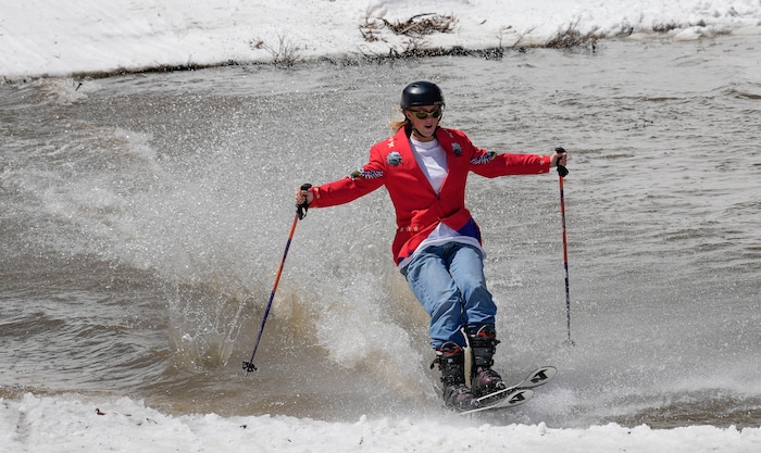 (Francisco Kjolseth  | The Salt Lake Tribune) Megan Broadbent of Draper easily skims across the pond in Peruvian Gulch as Snowbird closes the book on the 2024-25 ski season on Monday, May 26, 2025. Snow and sun revelers took to the slushy slopes on Memorial Day as the resort was the last in the state to close.
