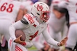 (Charlie Riedel | AP) Utah quarterback Devon Dampier runs the ball during the first half of an NCAA college football game against Kansas, Friday, Nov. 28, 2025, in Lawrence, Kan.