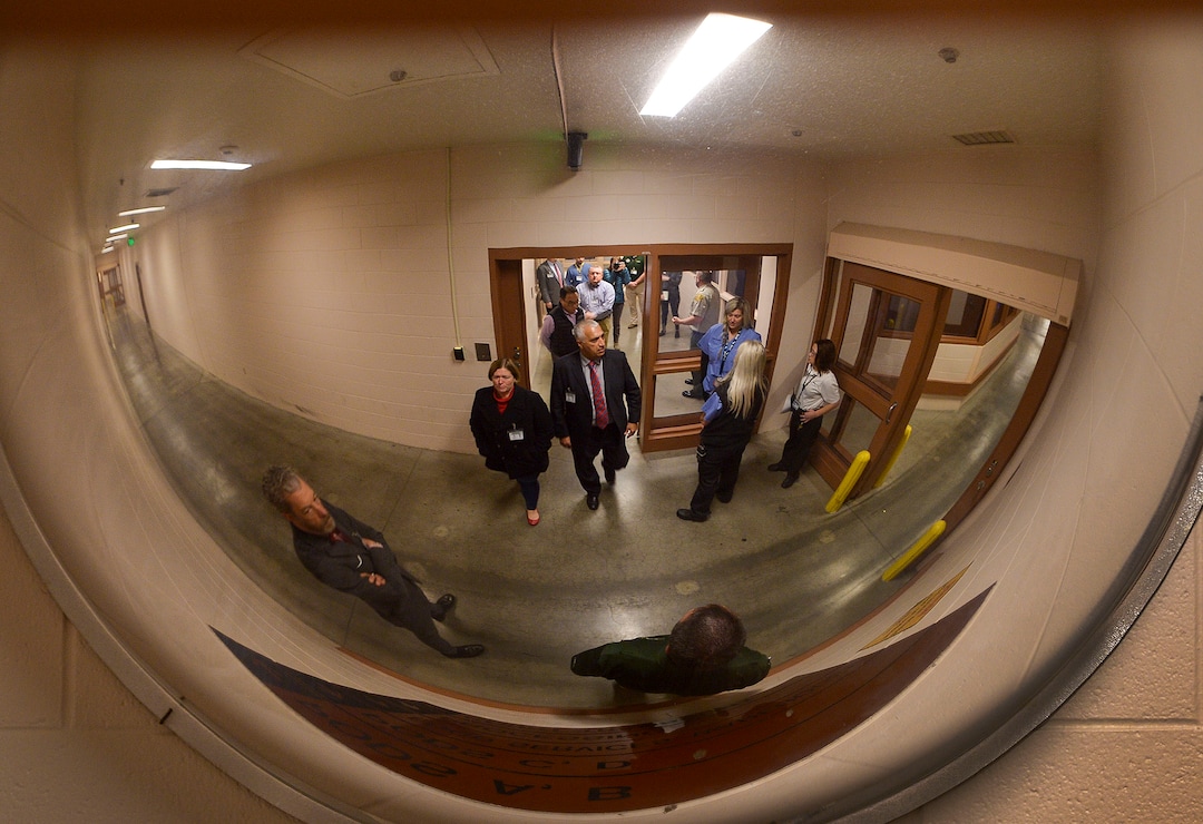 (Leah Hogsten  |  The Salt Lake Tribune) “Criminal justice reform is owning our decisions and figuring out how we can systematically improve,” said Salt Lake County District Attorney Sim Gill, center, entering the Salt Lake County Jail with eight employees led by Salt Lake County Sheriff Department’s Captain Corey Kiddle, left, Dec. 6, 2019.  Gill is pushing for the roughly 100 attorneys under his leadership in Salt Lake County and the district attorney’s office to visit the correctional facilities in which individuals prosecuted by their office are placed.