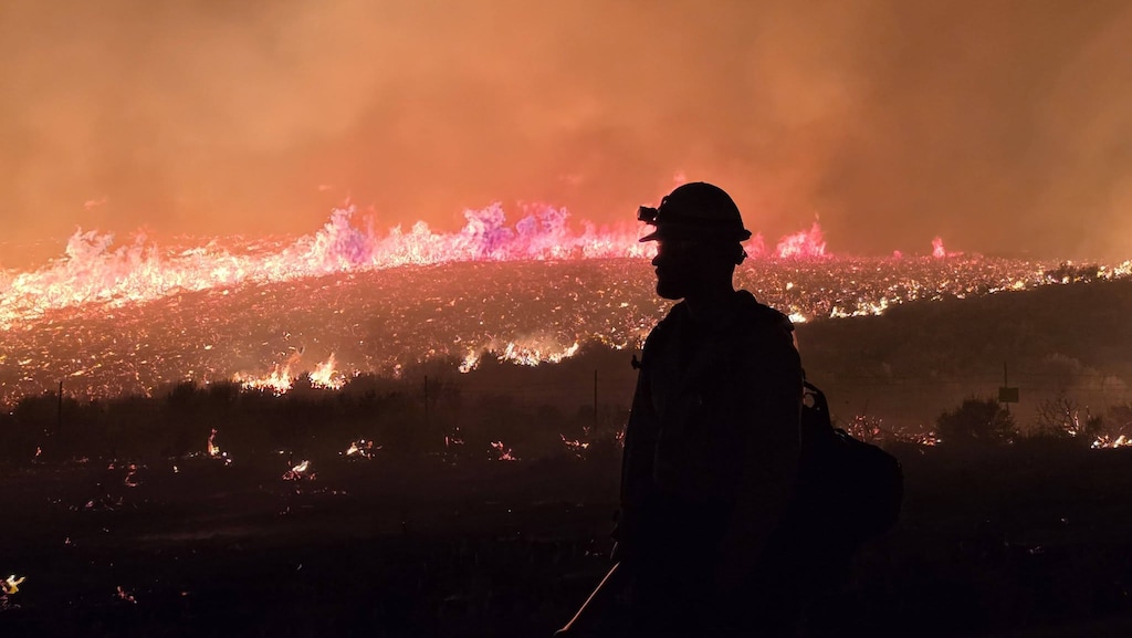 (Utah Fire Info via Facebook) Crews work on the Rocky Canyon Fire in Morgan County in a photograph released Sunday, Aug. 9, 2026.