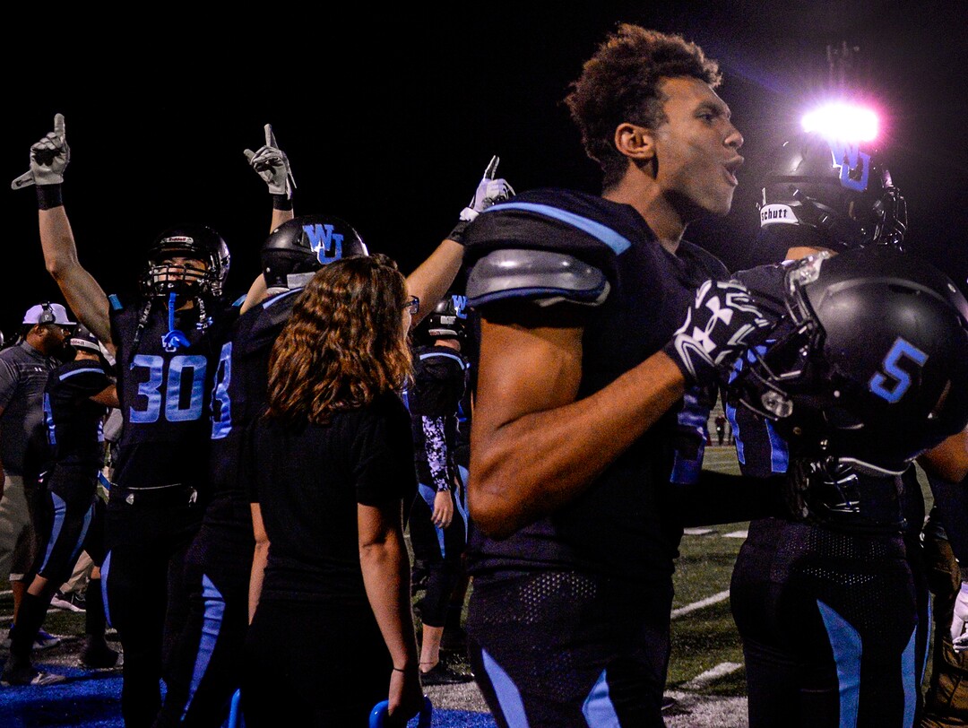 Leah Hogsten  |  The Salt Lake Tribune  l-r West Jordan's Wyatt Clark and Isaiah Kimball celebrate a gain of yards during  the game. West Jordan High School football team hosts Riverton High School, Thursday, Sept. 13, 2018 in West Jordan. 