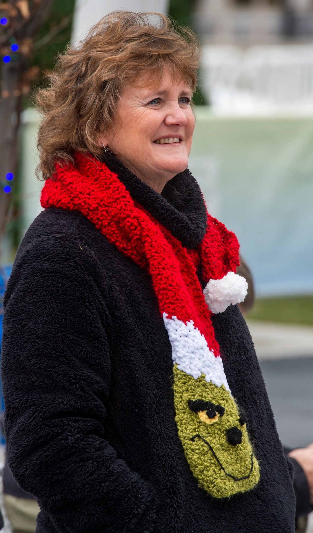 (Rick Egan  |  The Salt Lake Tribune)  Diane Kortbawi made 20 Grinch scarves for members of her family so she can tell them apart from the other skaters during their annual family ice skating outing on Christmas Eve at the Gallivan Center, Tuesday, Dec. 24, 2019. Kortbawi's  family has been ice skating on Christmas Eve for the past 35 years.