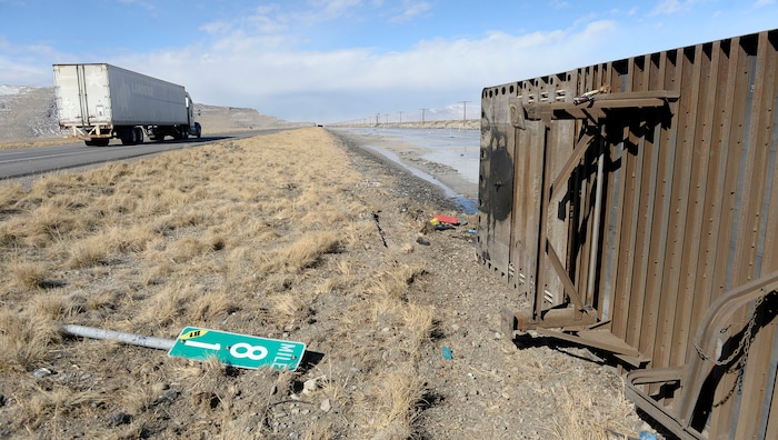 (Al Hartmann  |  The Salt Lake Tribune) 	One of three semi truck trailers that flipped over on I-80  westbound in high winds around 8:00 a.m. Friday March 2.  The incidents happened between mile posts 79 to 82 just east of the Rowley-Dugway exit in Tooele County.   Wrecking crews were kept busy all morning righting the rigs. 