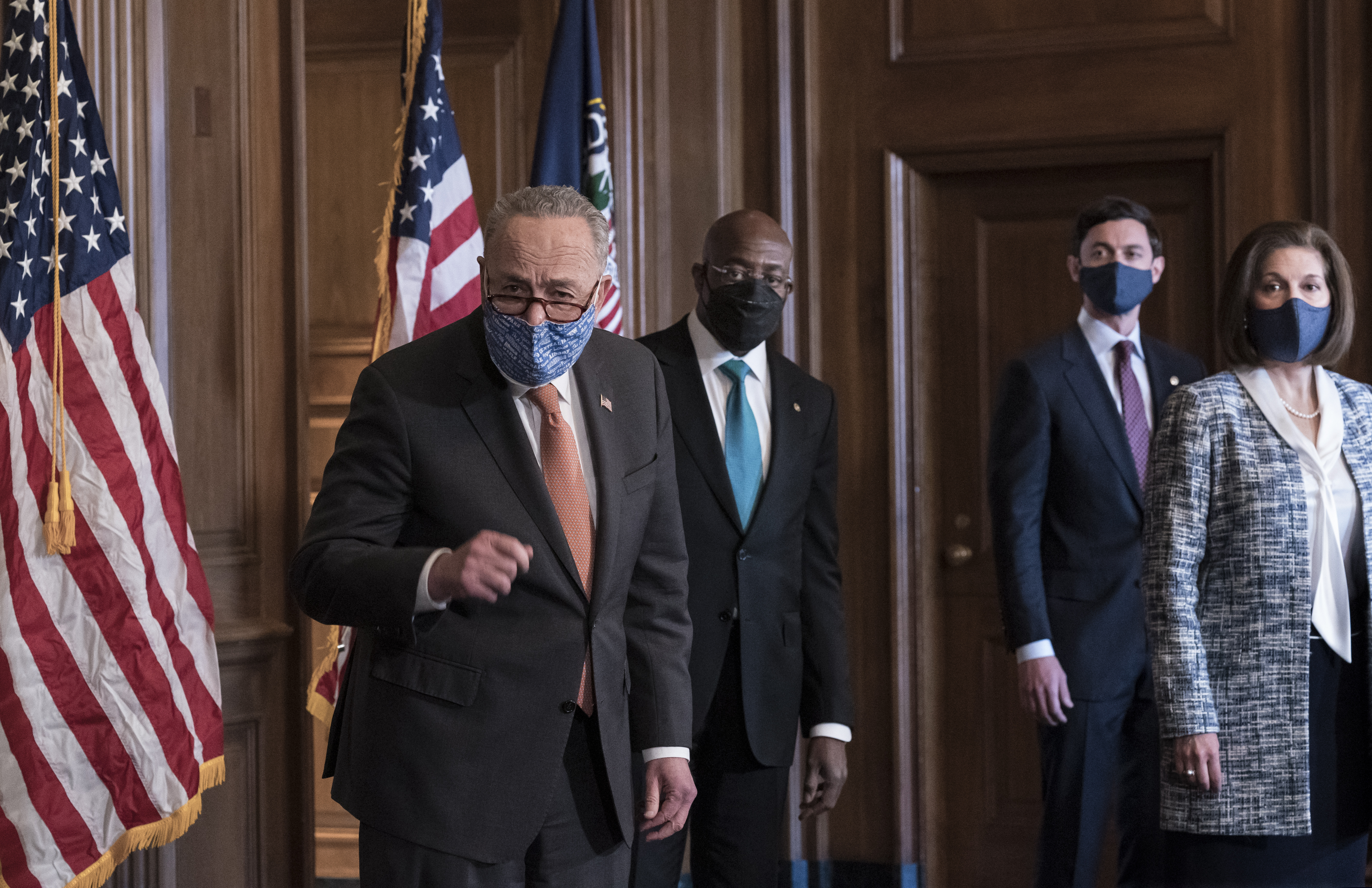 (J. Scott Applewhite | AP file photo)  Senate Majority Leader Chuck Schumer, D-N.Y., left, is joined by Sen. Raphael Warnock, D-Ga., center, and Sen. Jon Ossoff, D-Ga., with Sen. Catherine Cortez Masto, D-Nev., at the Capitol in Washington, Thursday, Jan. 21, 2021.