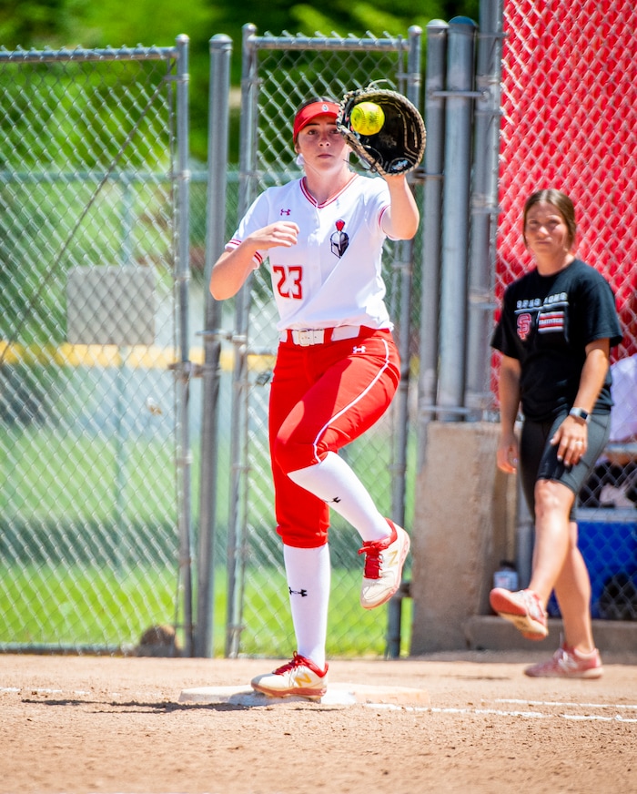 (Isaac Hale | Special to The Tribune) Mountain Ridge first baseman Brynnlee Murdock (23) makes a catch at first base during the second game of a best-of-three series between the Spanish Fork Lady Dons and the Mountain Ridge Sentinels as part of the 5A state softball championship held at the Spanish Fork Sports Park on Friday, May 28, 2021.