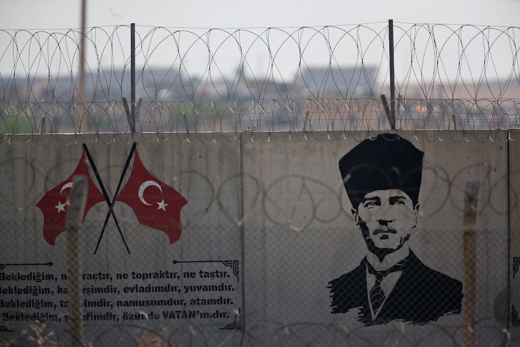 (Lefteris Pitarakis | AP file photo) A graffiti of modern Turkey's founder Mustafa Kemal Ataturk is seen on the Turkish side of the border between Turkey and Syria, in Akcakale, Sanliurfa province, southeastern Turkey, Tuesday, Oct. 8, 2019.