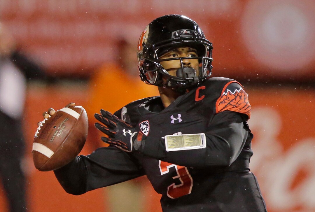 FILE - This Sept. 23, 2016, file photo, Utah quarterback Troy Williams looks down field in the second half during an NCAA college football game against Southern California in Salt Lake City. Utah returns to spring practices after spring break and continue to learn new offensive coordinator Troy Taylor's system. As the unit learns, there's also an open competition at quarterback between returning starter Troy Williams, sophomore Tyler Huntley and Alabama transfer Cooper Bateman. (AP Photo/Rick Bowmer, File)