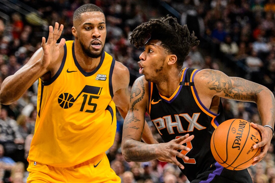 (Trent Nelson | The Salt Lake Tribune)  Phoenix Suns guard Elfrid Payton (2) drives on Utah Jazz forward Derrick Favors (15) as the Utah Jazz host the Phoenix Suns, NBA basketball in Salt Lake City, Wednesday Feb. 14, 2018.