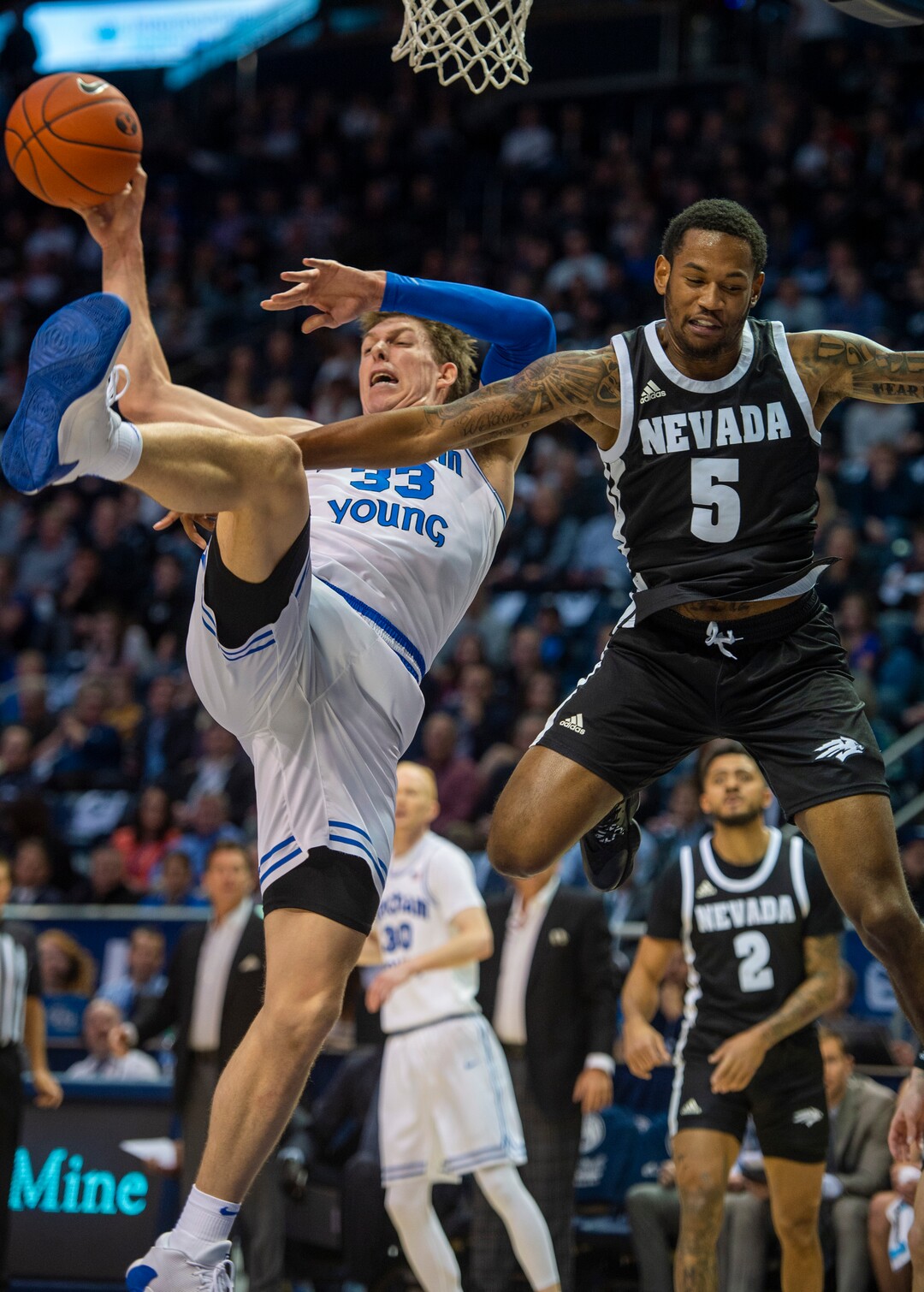 (Rick Egan  |  The Salt Lake Tribune)       Nevada Wolf Pack guard Nisre Zouzoua (5) stops a layup by Brigham Young Cougars forward Dalton Nixon (33), in basketball action between the Brigham Young Cougars and the Nevada Wolf Pack, at the Marriott Center, in Provo, Saturday, December 10, 2019.