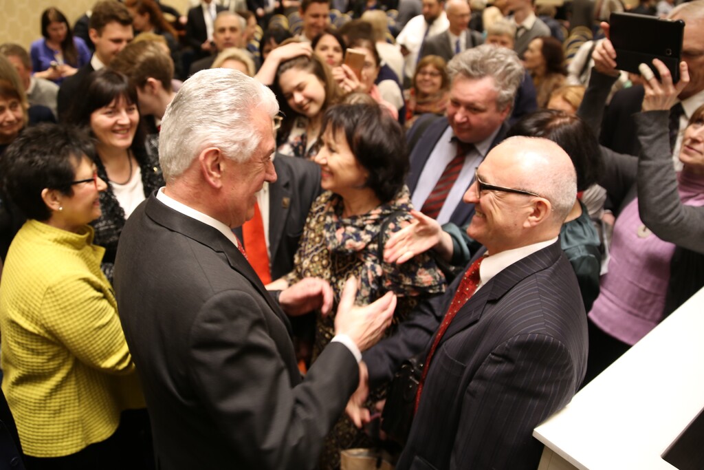 (Courtesy LDS Church) Elder Dieter F. Uchtdorf of the Quorum of the Twelve Apostles and his wife, Harriet, greet Latter-day Saints in Moscow, Russia, April 22, 2018.