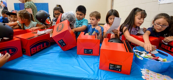 Steve Griffin  |  The Salt Lake TribuneKids at the Lied Boys & Girls Club open their own bike helmet donated by UnitedHealthcare to help encourage kids and families to participate in the Tour of Utah kidsÕ events. Club youth will received the helmets and a helmet-fitting from UnitedHealthcare Pro Cycling Team members, as well as a lesson in helmet and bike safety in Salt Lake City Friday July 28, 2017.