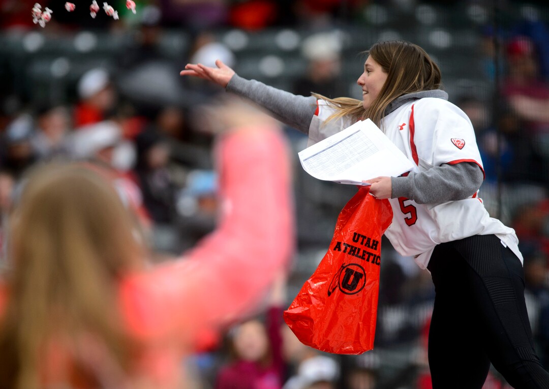 (Steve Griffin  |  The Salt Lake Tribune)  Fan get saltwater taffy between innings of the BYU versus Utah baseball game at Smiths Ballpark in Salt Lake City Tuesday April 3, 2018.