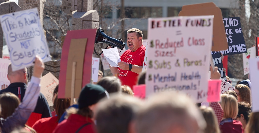 (Leah Hogsten | The Salt Lake Tribune) Mike Harman with the teacher's union rallies the crowd before the march. Teachers in Salt Lake City's teacher's union stage a walkout and rally at the Capitol to protest teacher pay in an effort to pressure the Utah State Legislature as it decides how much money it will allocate to the state's education system Friday. Teachers began the rally at the Federal Building and walked up Capitol Hill to the statehouse for a rally in the rotunda, Feb. 28, 2020.