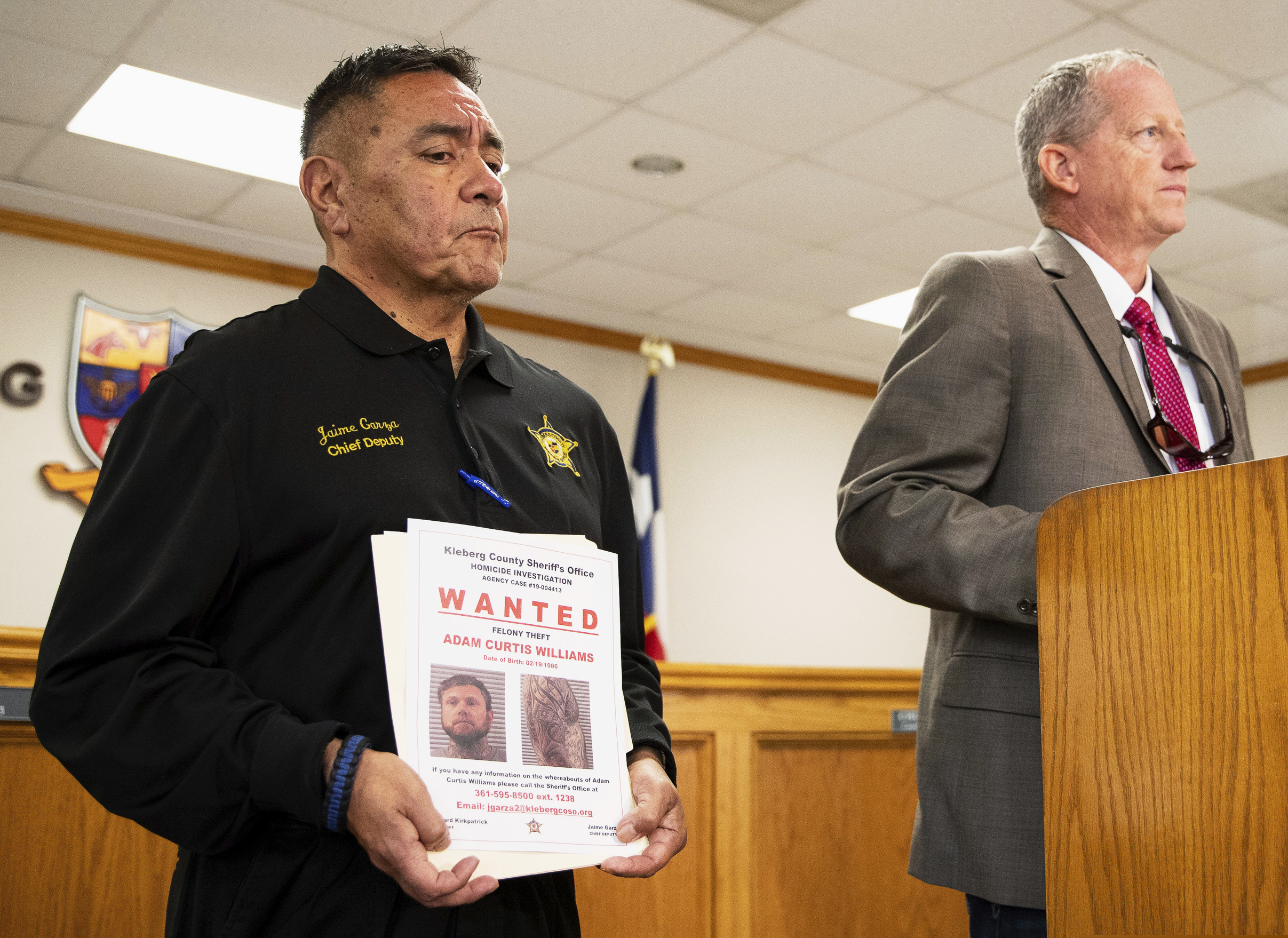 (Courtney Sacco | Corpus Christi Caller-Times | AP) Kleberg County Sheriff’s Office's Chief Deputy Jaime Garza listens as Kleberg County Sheriff Richard Kirkpatrick speaks during a news conference in Corpus Christi, Texas, Tuesday, Nov. 5, 2019. Authorities say a 33-year-old Utah man was arrested in Mexico on a charge that he stole the truck and RV belonging to the couple.