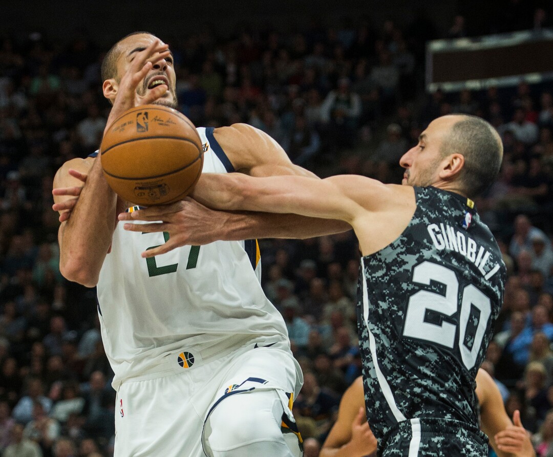 (Rick Egan  |  The Salt Lake Tribune)  San Antonio Spurs guard Manu Ginobili (20) stops a fast break by fouling Utah Jazz center Rudy Gobert (27), in NBA action, in Salt Lake City, Monday, February 12, 2018.