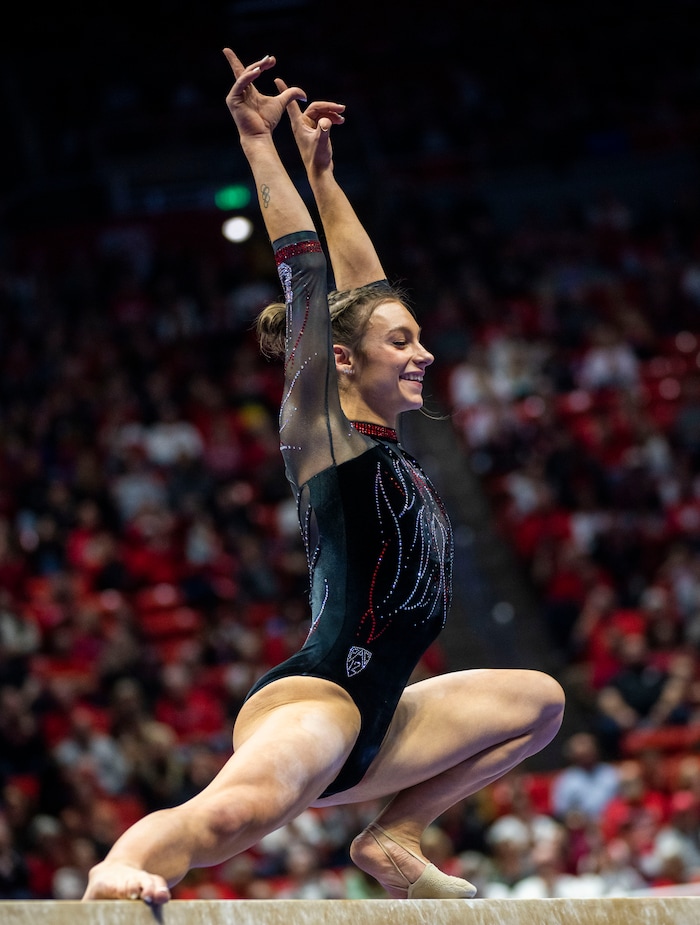 (Rick Egan | The Salt Lake Tribune)  Grace McCallum competes on the beam, in gymnastics action between Utah Red Rocks and Oregon State, at the Jon M. Huntsman Center, on Friday, Feb. 2, 2024.
