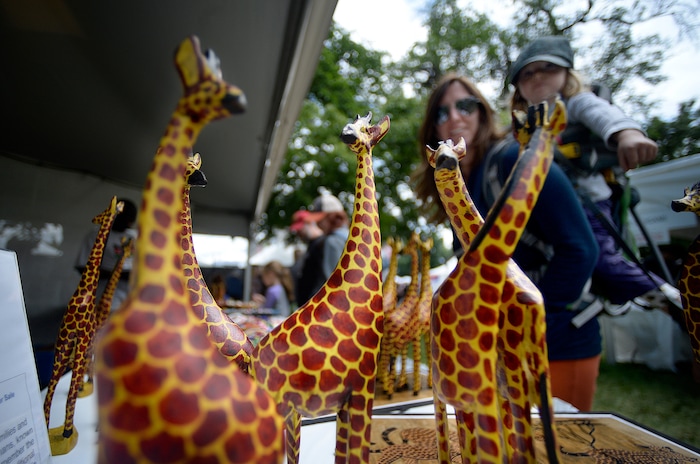 ( Scott Sommerdorf | The Salt Lake Tribune ) Carved giraffes from South Sudanese artists on display at the 32nd Living Traditions Festival in 2017.  The 2019 festivals runs Friday, May 17, through Sunday, May 19.
