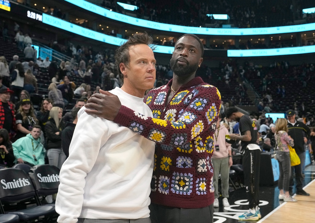 (Leah Hogsten | The Salt Lake Tribune) Ryan Smith and  Dwyane Wade after the game between the Utah Jazz and the Dallas Mavericks at Vivint Arena on Monday, February 6, 2023.