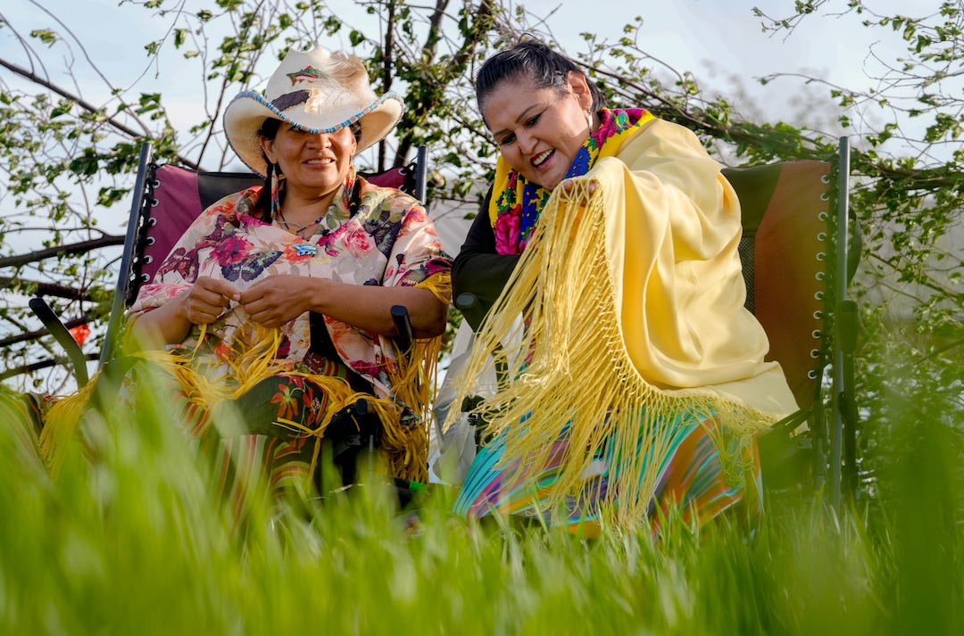(Francisco Kjolseth | The Salt Lake Tribune) Sarah Cuch, left, and Vicky Yellowhorse talks about traditional colorful clothing worn to commemorate the first Bear Dance in the reservation community of Whiterocks, Utah, on Thursday, May 19, 2022, for the first time in 20 years.