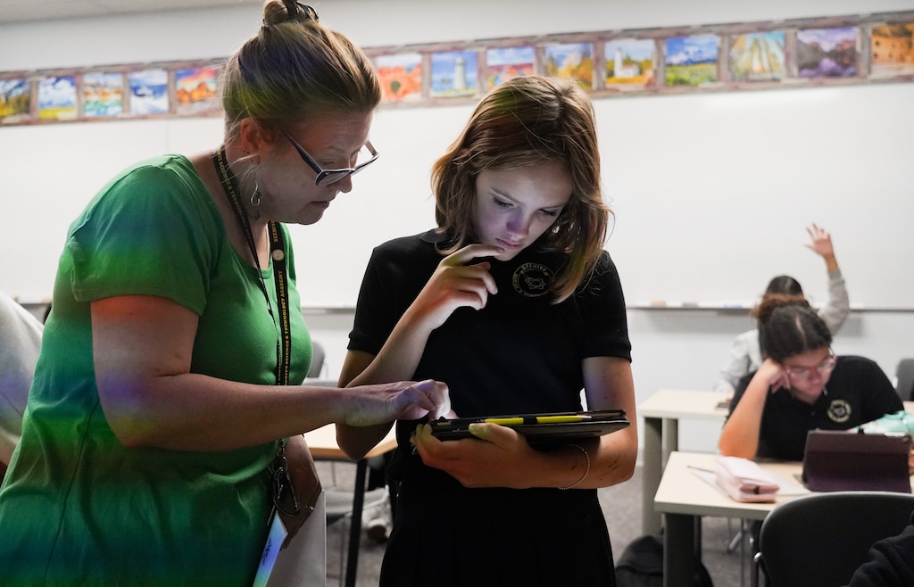 (Bethany Baker | The Salt Lake Tribune) Maria Andersen, left, works with Teagan Bigham during a class at Beehive Science and Technology Academy in Sandy on Wednesday, Sept. 6, 2023. Student enrollment between charter schools and Utah school districts has fluctuated since 2018, but charters have seen growth in the past year.