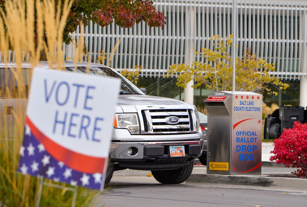 (Chris Samuels | The Salt Lake Tribune) A voter drops off their ballot at Taylorsville City Hall, Friday, Nov. 4, 2022.